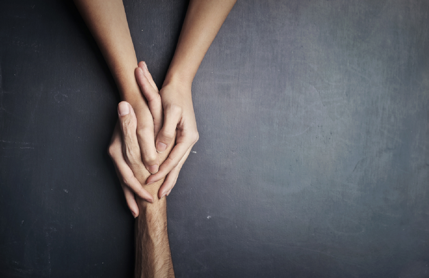 Hands holding to represent the action of supporting