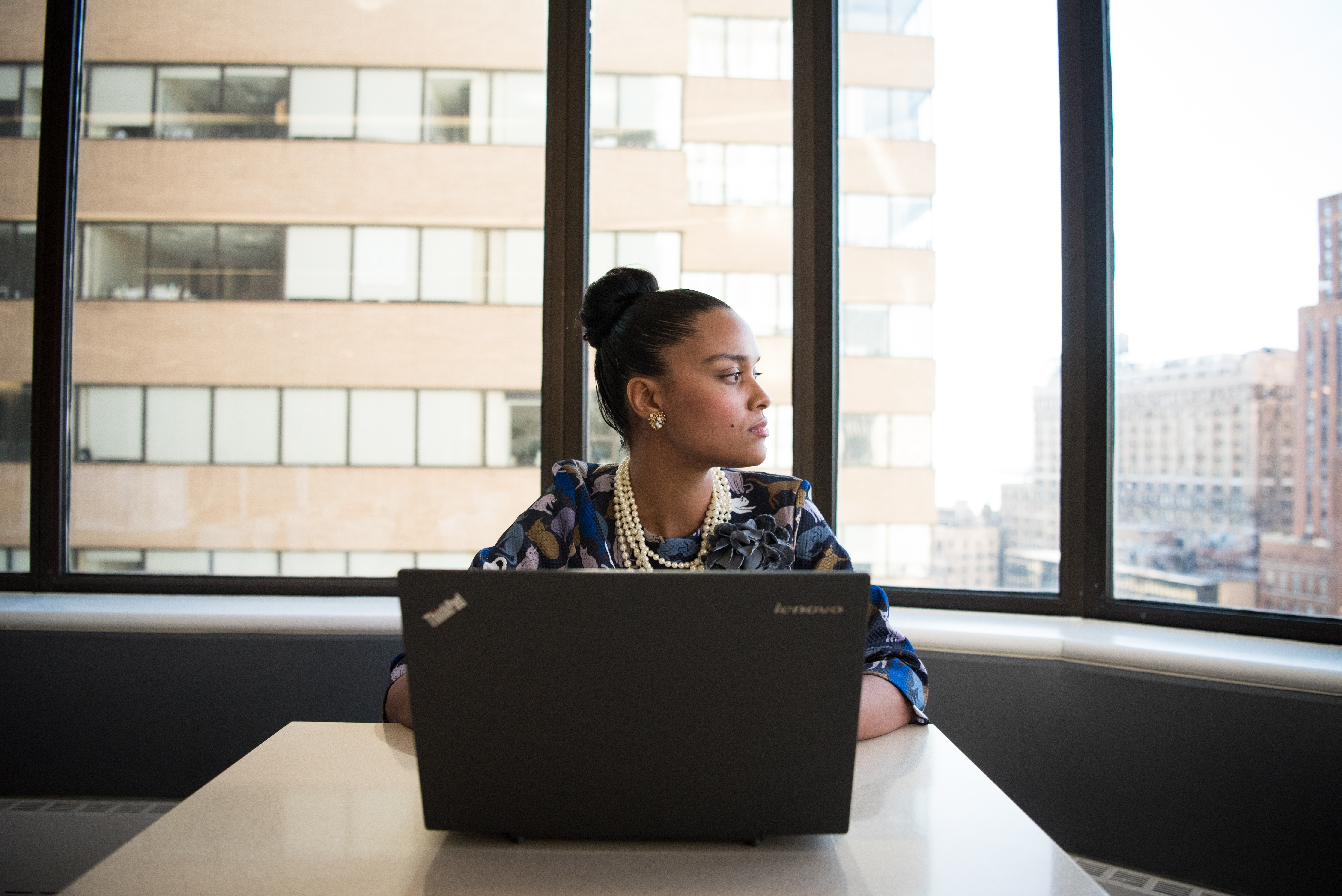 Canva - Woman Sits in Front of Black Laptop Computer