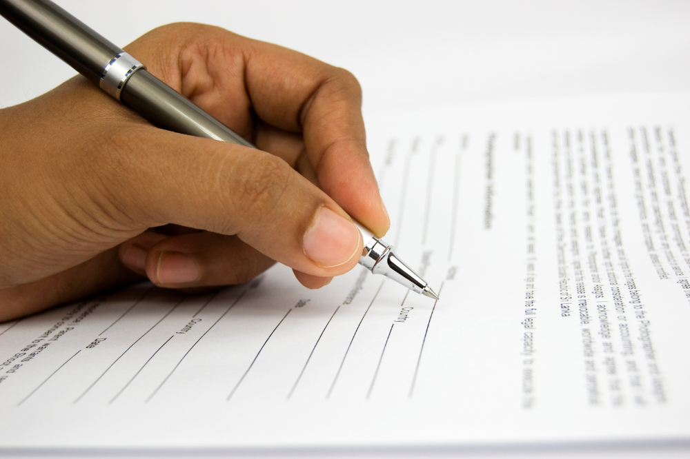 signing a form, representing what happens when you claim insolvency